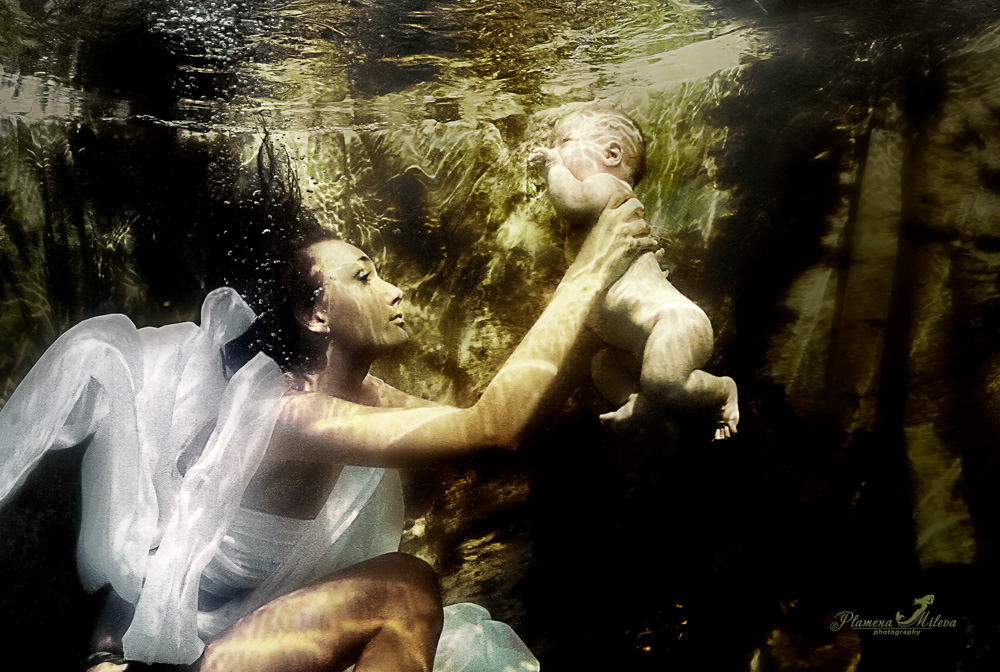 © Plamena Mileva | This is the first photograph I took in a swimming pool. My son, that he was only three months in the hands of a model, interpreting the theme of maternal love. Canon 7D with EF-S 24mm f2.8