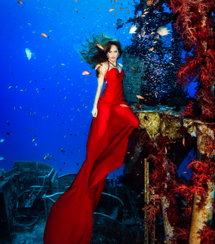 © Plamena Mileva |  Red Sea goddess woman This has been the first composition that I realized in Eilat Red sea underwater photography competition last year 2014. Almost all the photographs turned out lovely and I also then participated in other competitions with these pictures with great success. I was very lucky choosing the best model, Ellie Biel, who was impeccable. Furthermore, not many people can say they have had a photograph session in a shipwreck and wearing jewellery worth more than 100 000 $.