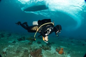 Diver under boat, Cozumel, taken with the UWL-09 Wide Angle lens